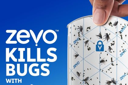 BuggyBands Flying Insect Trap kit featuring two white plug-in devices with soft blue UV lights and eight adhesive refill cartridges designed to trap fruit flies, gnats, and other flying pests indoors