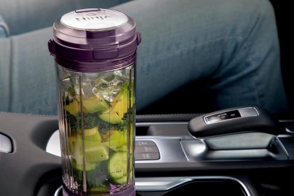 Ninja BC151PR Blast Portable Blender in Passion Red with 18 oz. cup and sip lid on white background