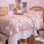 Bedsure Pink Twin XL Comforter neatly spread on a bed, soft and fluffy with a light blush pink color, ideal for dorm rooms and minimalist bedroom décor.