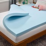 LINENSPA Memory Foam Mattress Topper on a queen-size bed