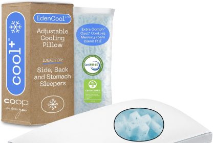 "Coop Home Goods adjustable memory foam pillow with soft, breathable Lulltra cover shown on a neatly made bed in a bright, cozy bedroom."