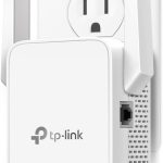 TP-Link RE315 AC1200 WiFi Range Extender plugged into a wall outlet, compact design for boosting wireless signal coverage in home or small office.