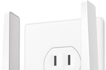 TP-Link RE315 AC1200 WiFi Range Extender plugged into a wall outlet, compact design for boosting wireless signal coverage in home or small office.