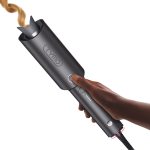 "TYMO Automatic Rotating Curling Iron – lightweight, sleek pink hair curling wand with auto-rotation, anti-tangle design, and digital temperature control for effortless styling"