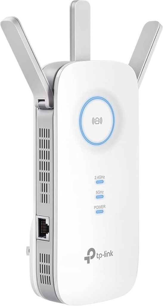 TP-Link RE550 WiFi Extender plugged into a wall socket in a modern living room