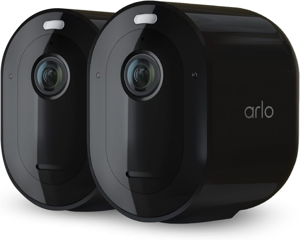 Arlo Pro Spotlight Camera mounted on house exterior at night